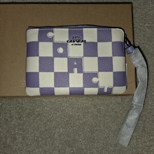 Corner zip wristlet with checkerboard print in violet /chalk. Beautiful pattern!